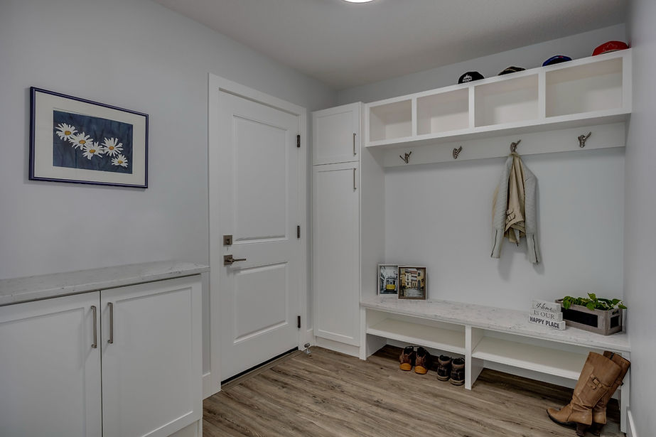 A fantastic storage area with coat hook, storage space and a low cupboard on the right.